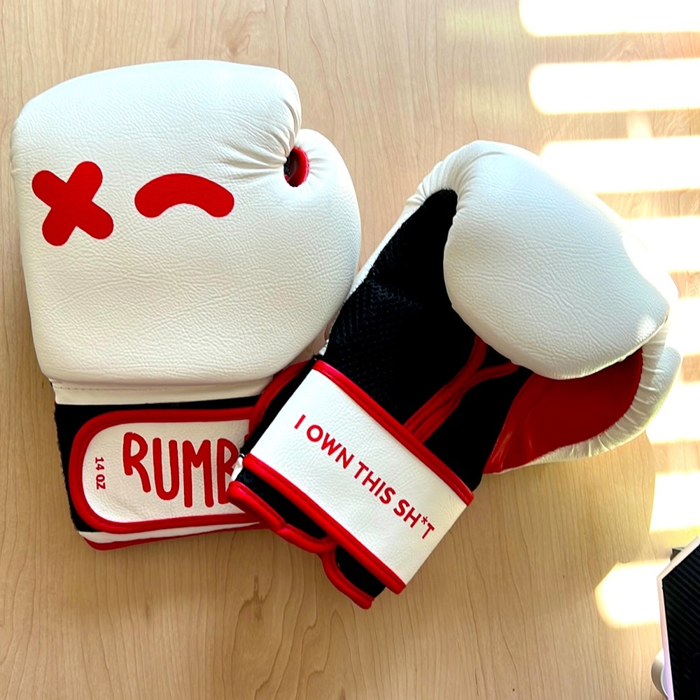 Rumble branded boxing gloves with carrying bag. Never worn.